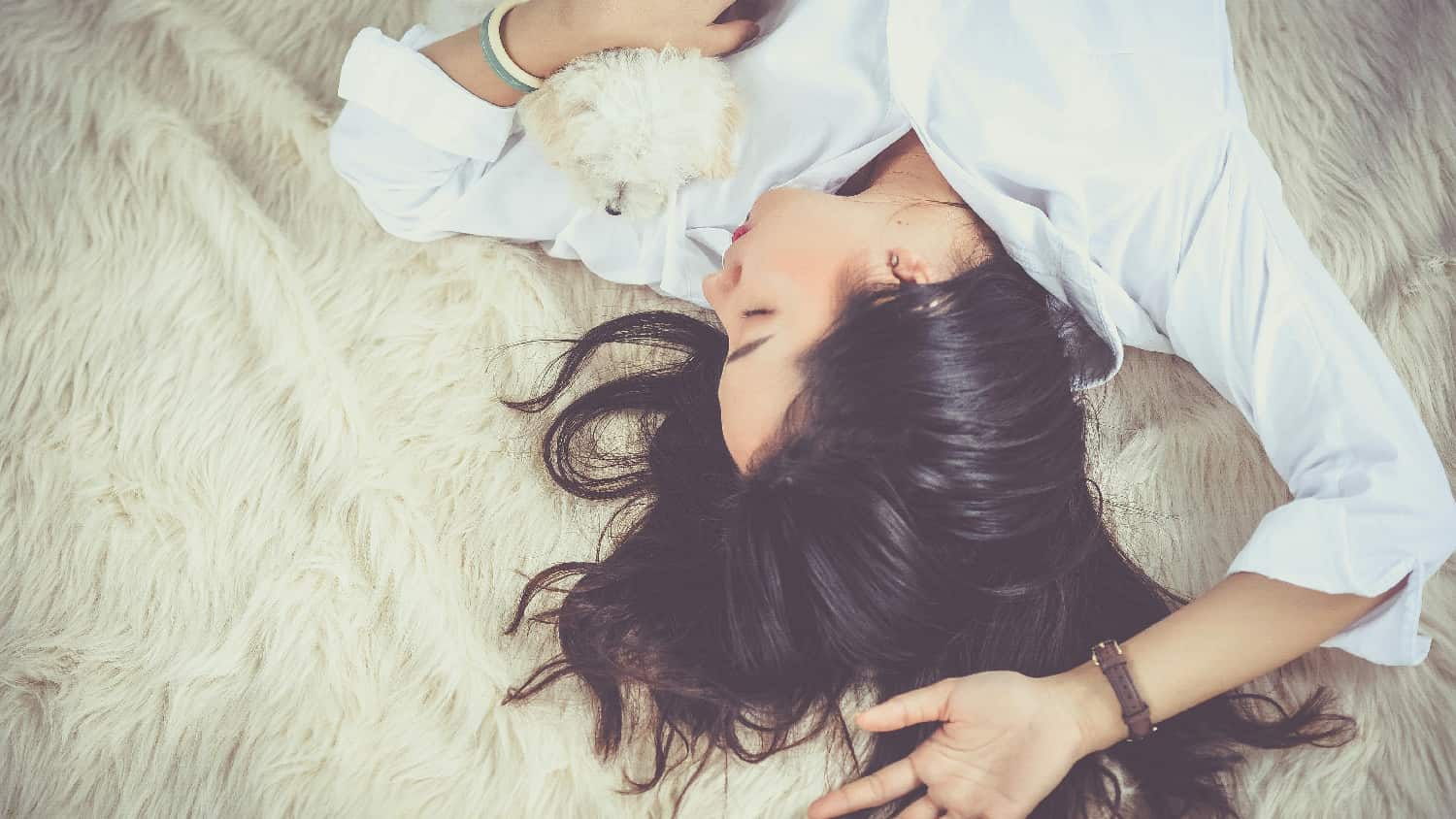 A woman appears deeply asleep in a dimly lit room, influenced by depressants, raising awareness about their sedative effects.