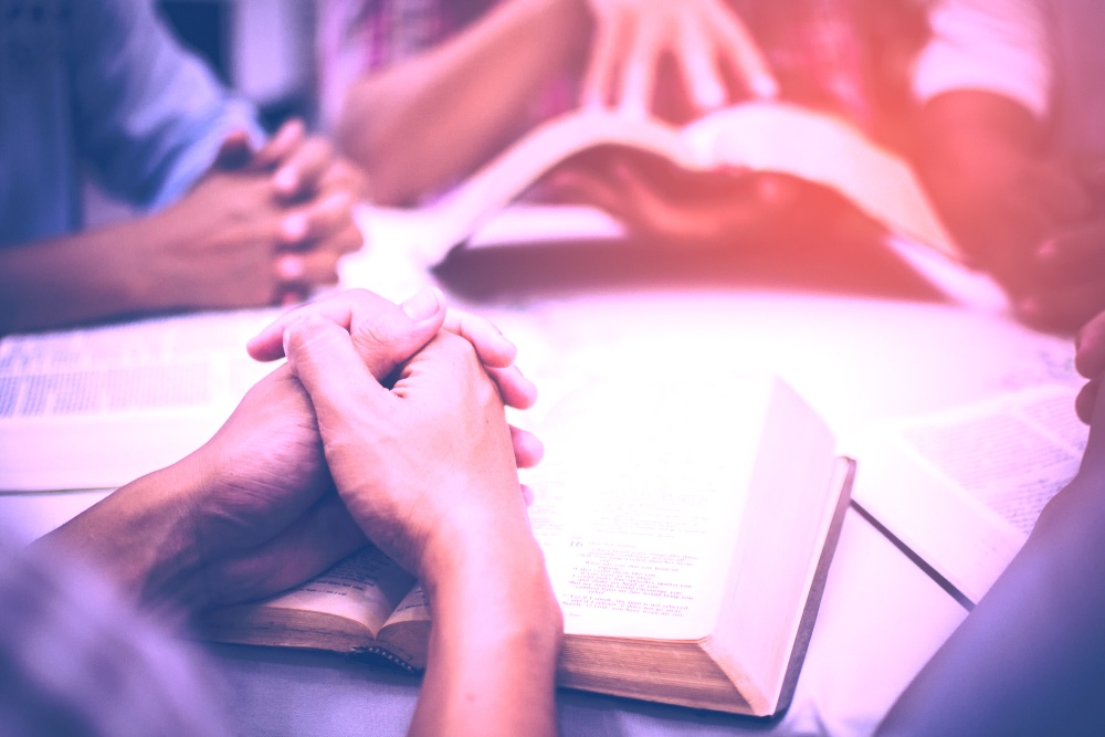 Group of people in rehab reading the Bible