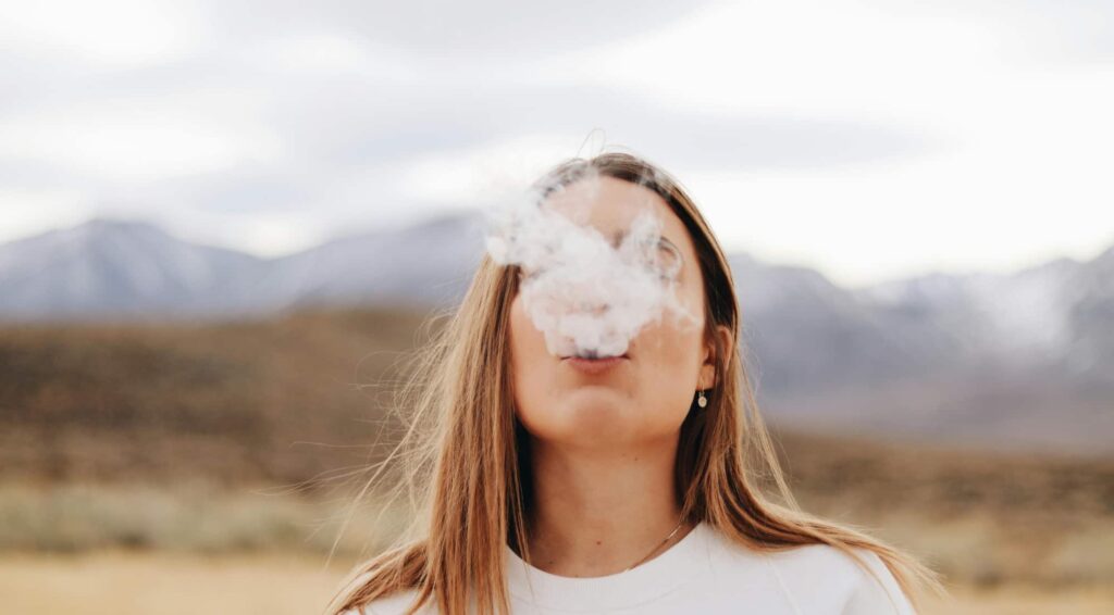 Young woman vaping in Orange County, CA to show the power of gateway drugs. s