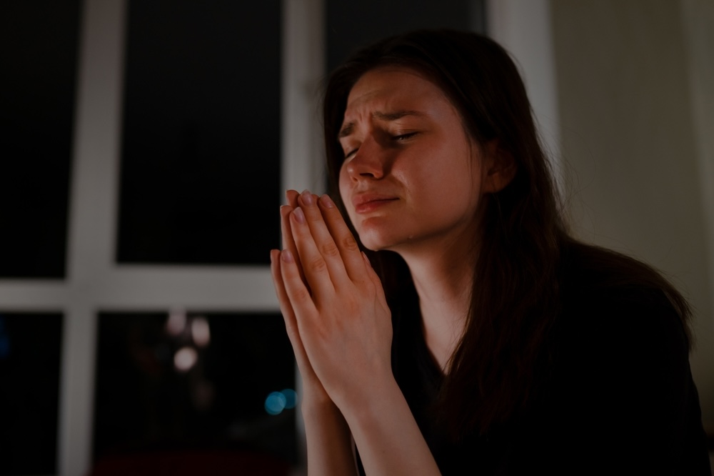 Female young adult crying for her depression to pass