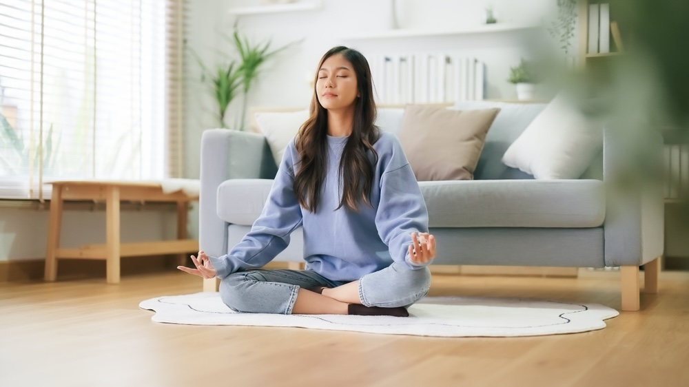 Woman practicing meditation after getting out of rehab